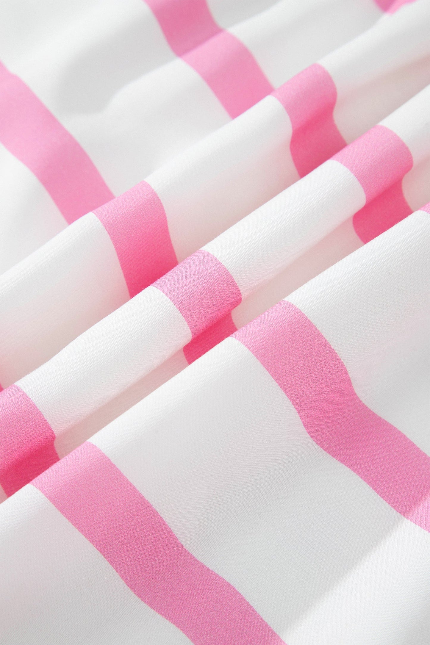 Pink-and-white striped fabric pattern on a maxi dress