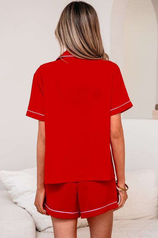 Red silky pajama shorts set, back view with matching short sleeves and piping trim