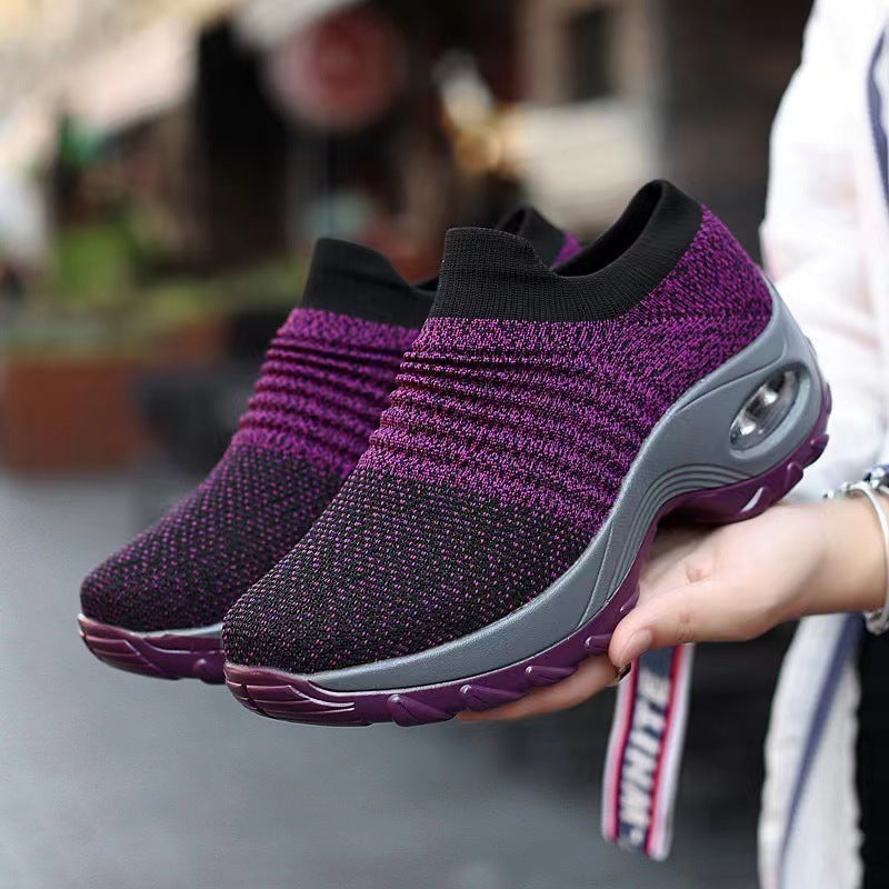 Purple knit slip-on sneakers with purple trim and visible air-cushion window