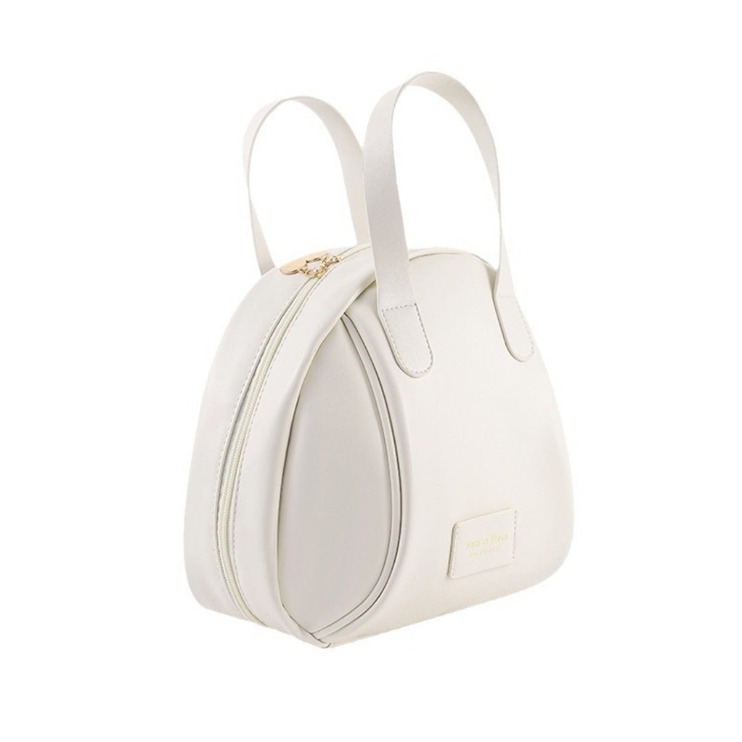 Beige waterproof makeup tote bag, rounded silhouette with two top handles and zipper