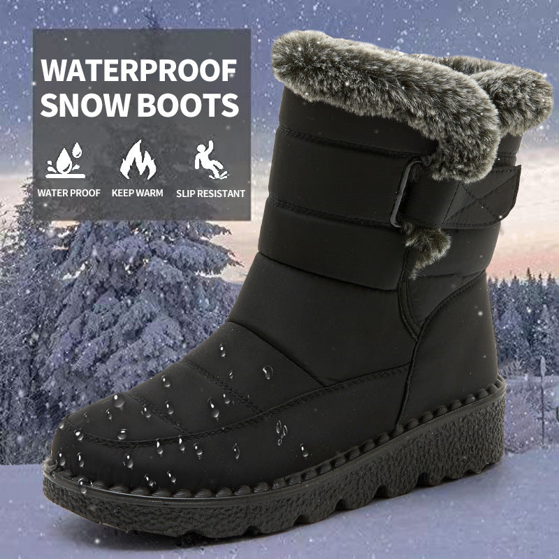 Black waterproof snow boots with faux-fur cuff, hook-and-loop strap, grippy platform sole