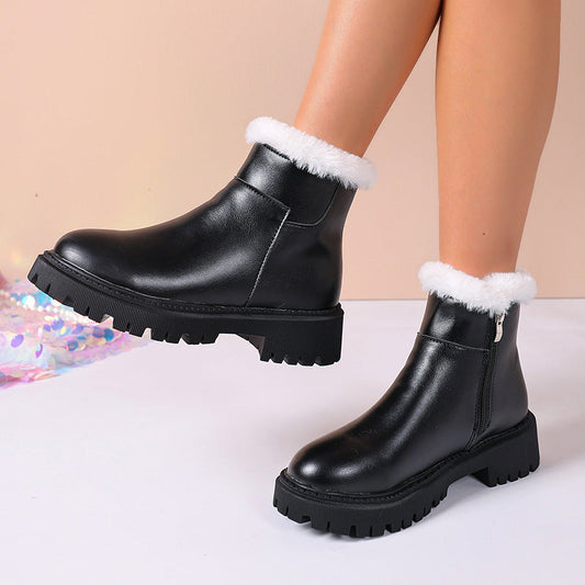 Black insulated ankle boots with white faux-fur cuff and chunky lug sole