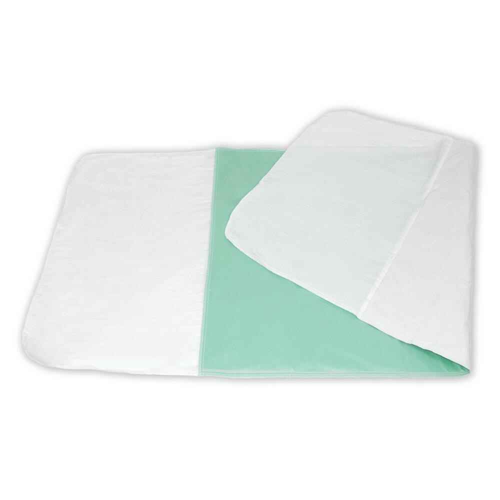 White top washable underpad with mint backing, overlapping folded pads