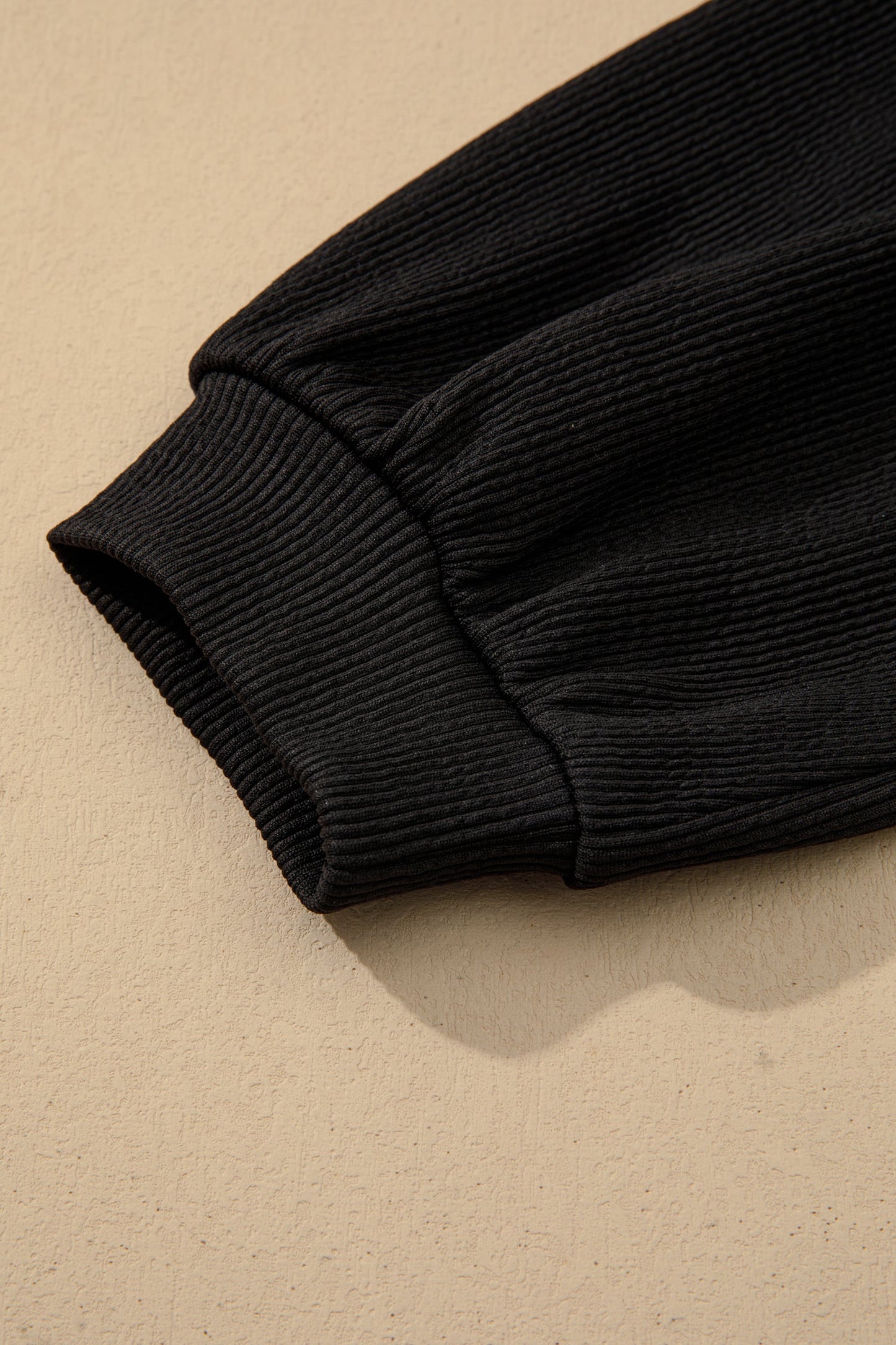 Black ribbed sleeve with elastic cuff detail on A-line dress