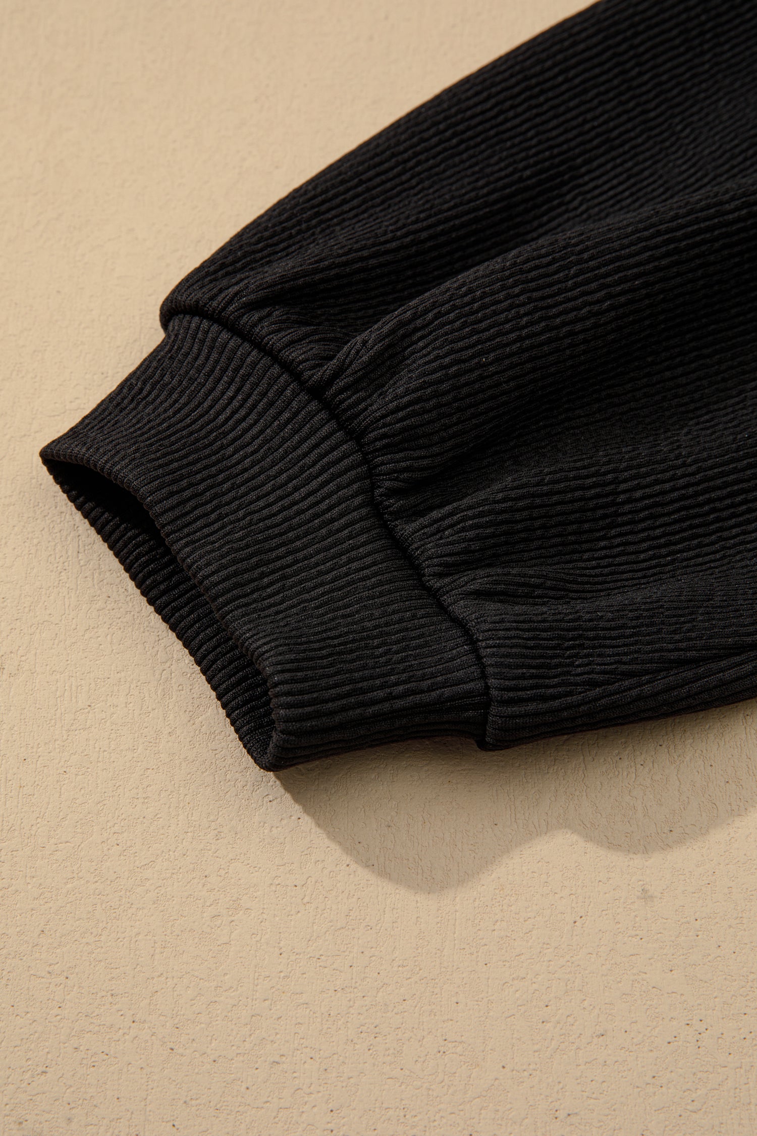 Black ribbed sleeve with elastic cuff detail on A-line dress