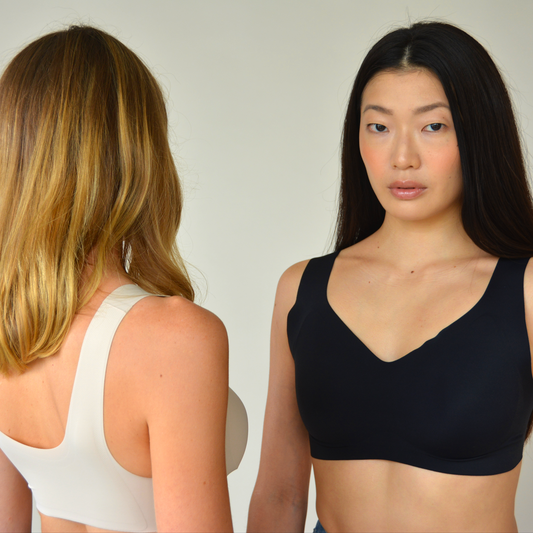 Black v-neck lift bra with smooth cups; white back strap visible.