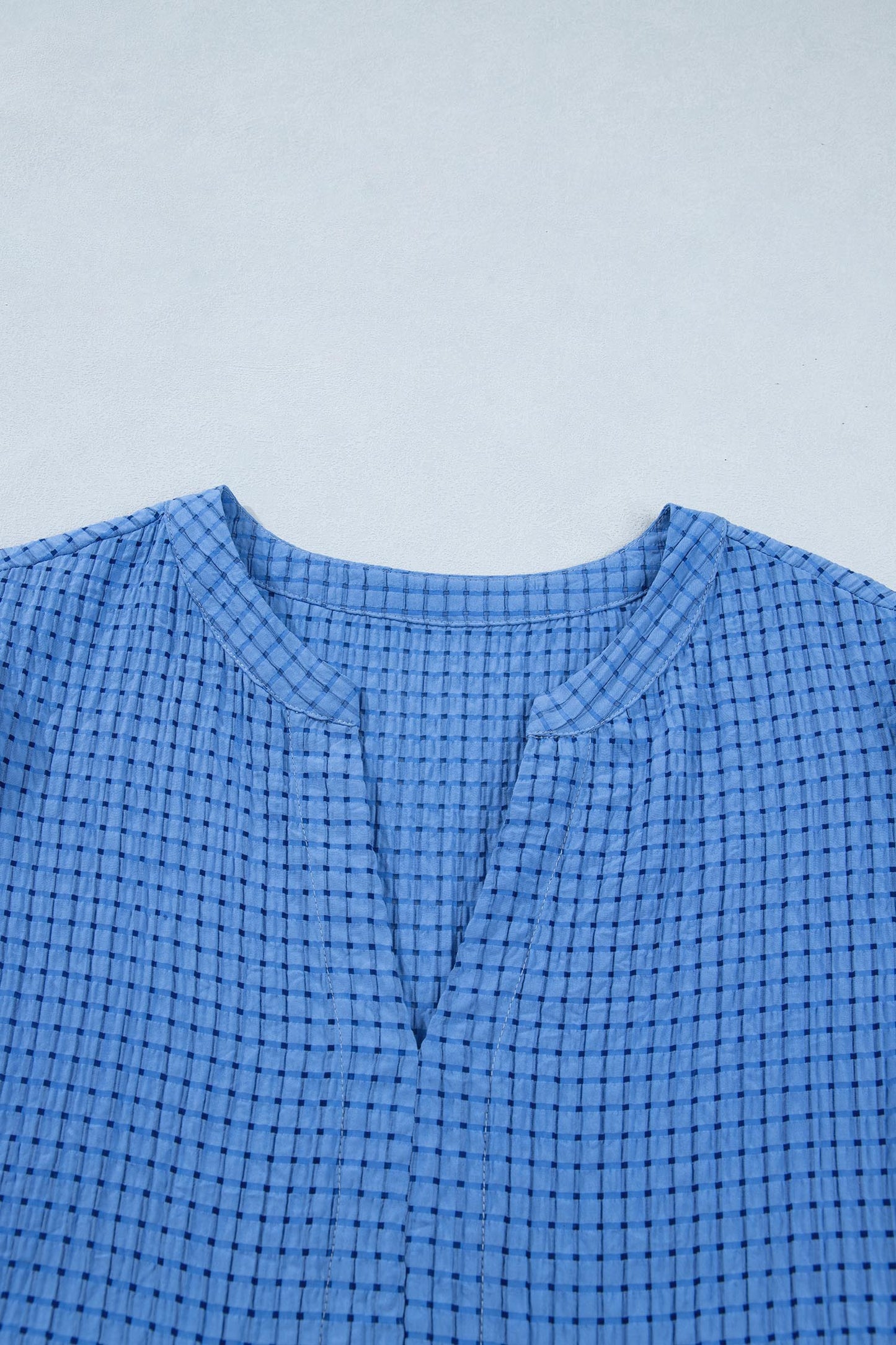 Dusk blue checkered midi dress with round neckline and button placket