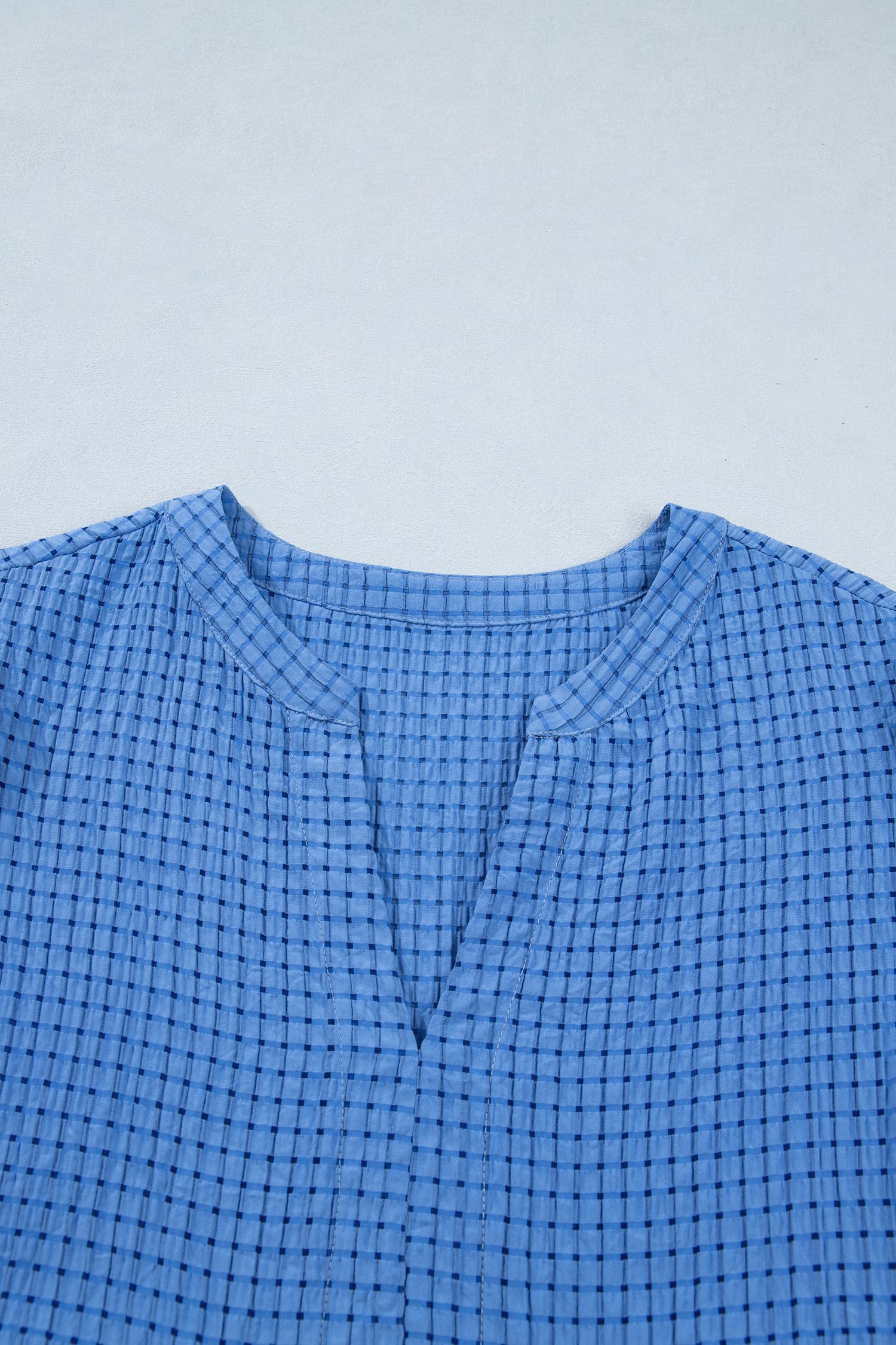 Dusk blue checkered midi dress with round neckline and button placket