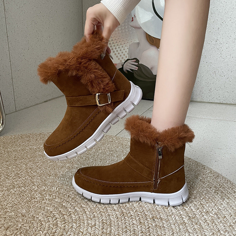 Brown suede ankle snow boots with faux fur cuff, side zipper, buckle strap, chunky white sole