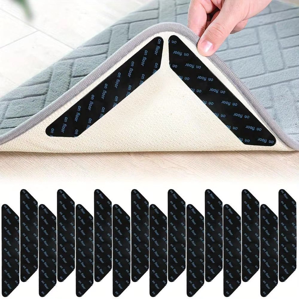 Rug gripper pads under rug edge; white backing with black on-floor adhesive strips