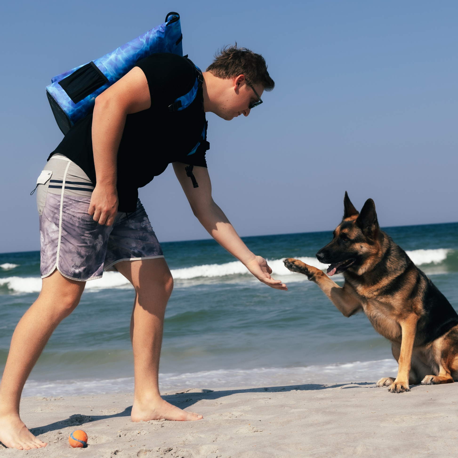 Waterproof floating cooler backpack, blue bag with dry pocket front and black adjustable straps