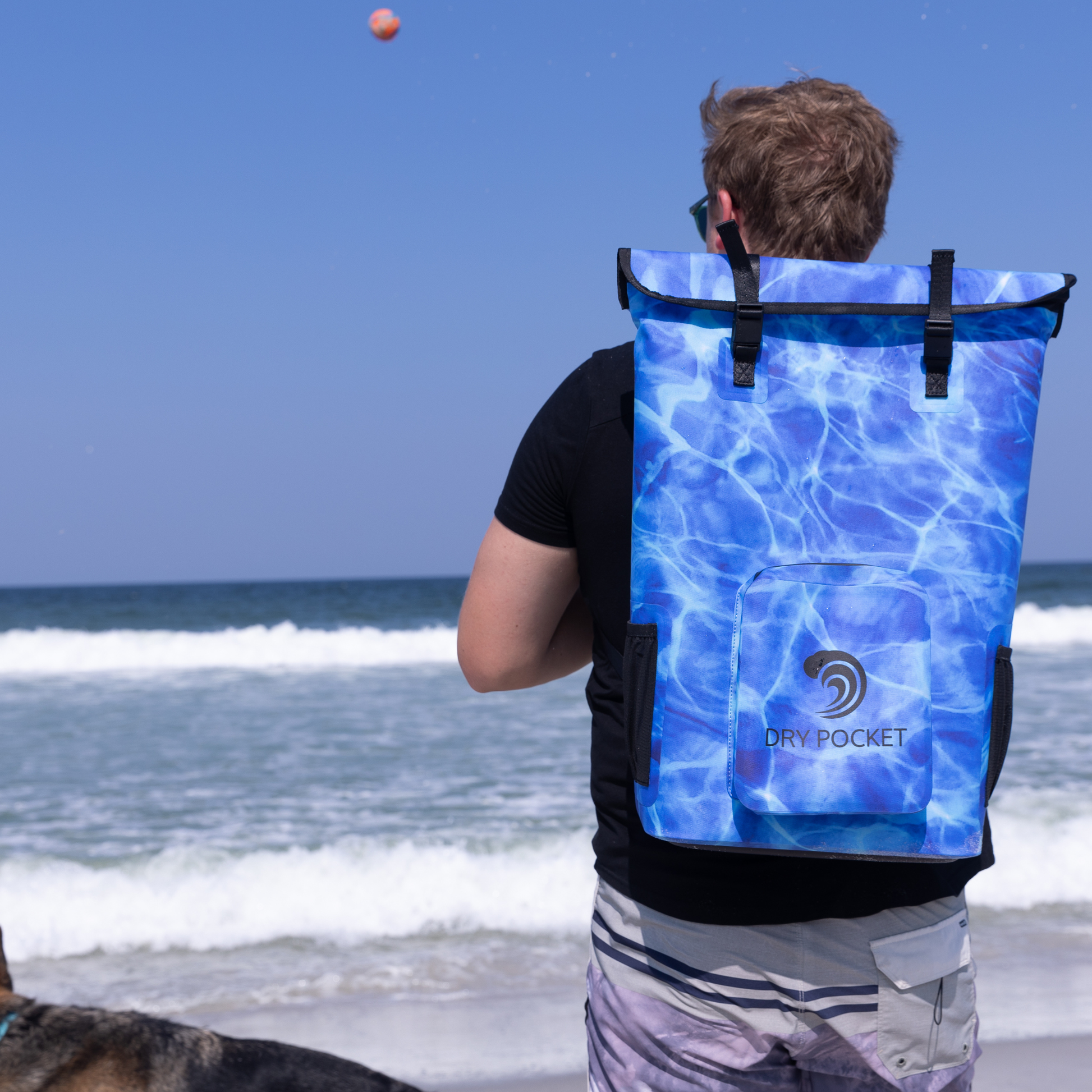 Waterproof floating cooler backpack, blue with black straps and front dry pocket panel