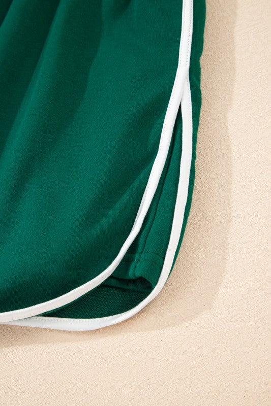 Green mini skirt with white striped side trim and drawstring lace