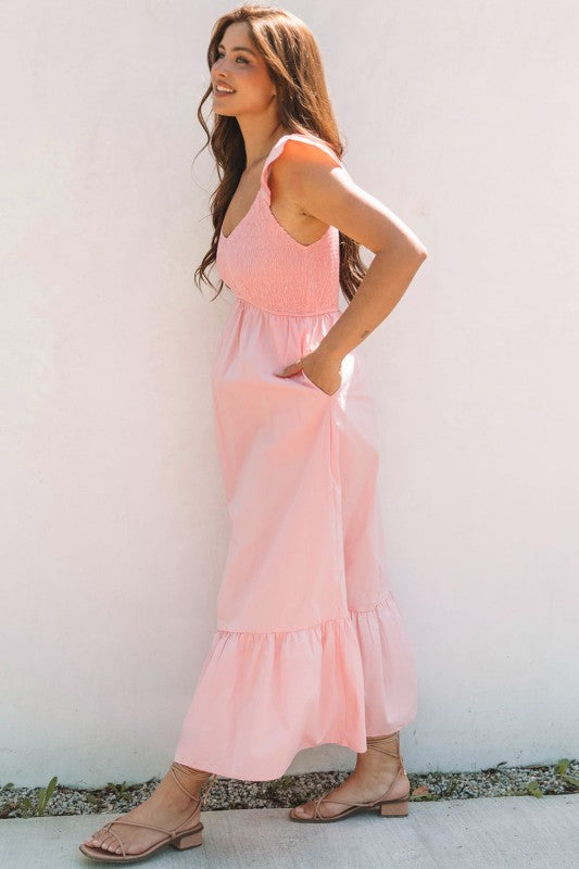 Apricot pink maxi dress side view with smocked bodice and flutter cap sleeves