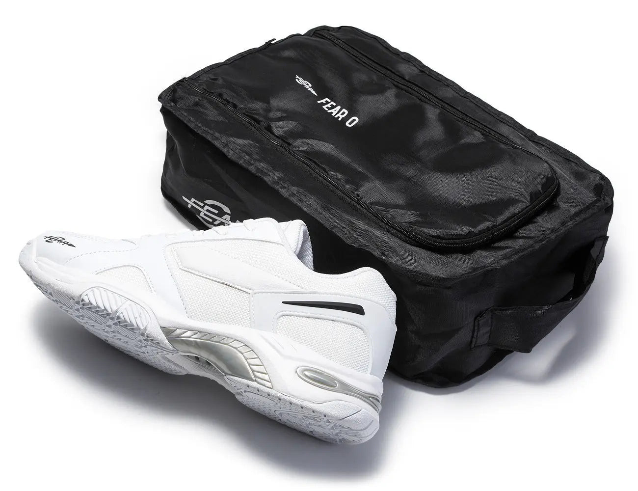 Men's white walking shoe with black reusable shoe storage bag