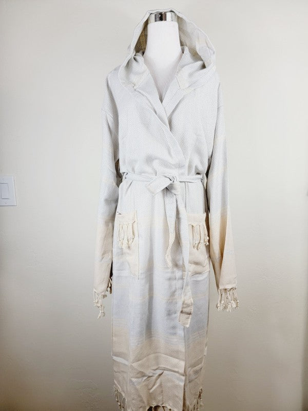 Off-white hooded robe with belt and patch pockets; long length and tassels