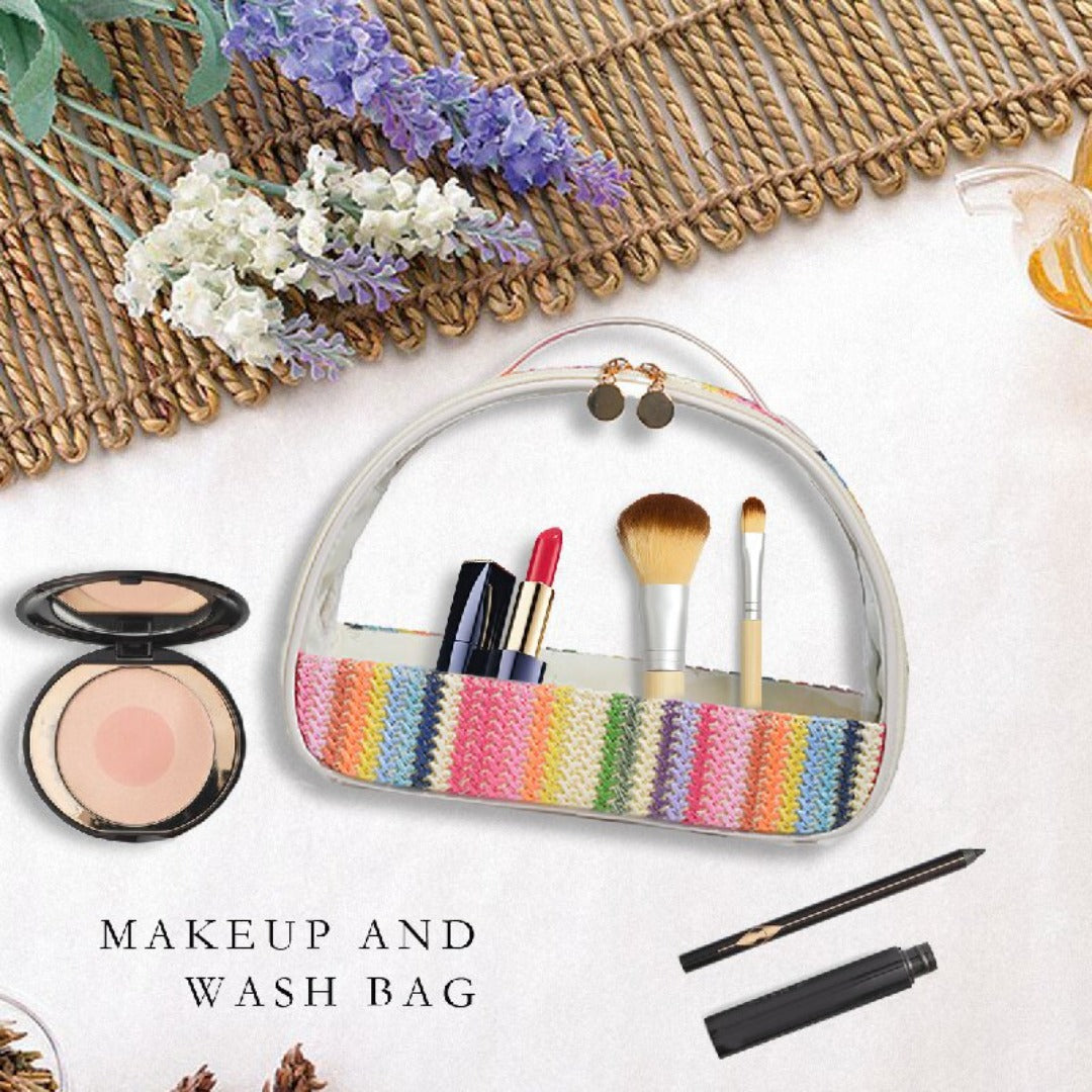 Rainbow striped clear makeup wash bag open, showing brushes and cosmetics inside
