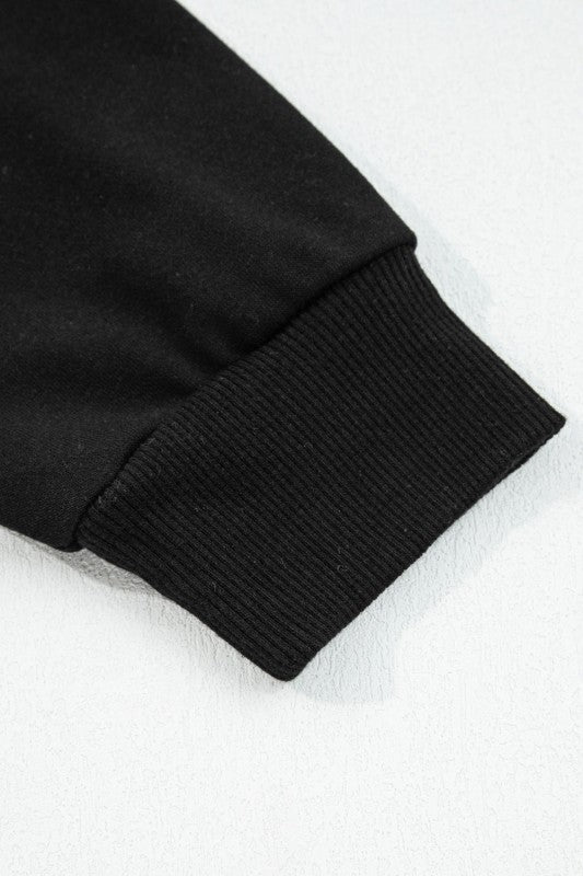 Varsity stripe pullover black ribbed sleeve cuff with knit texture
