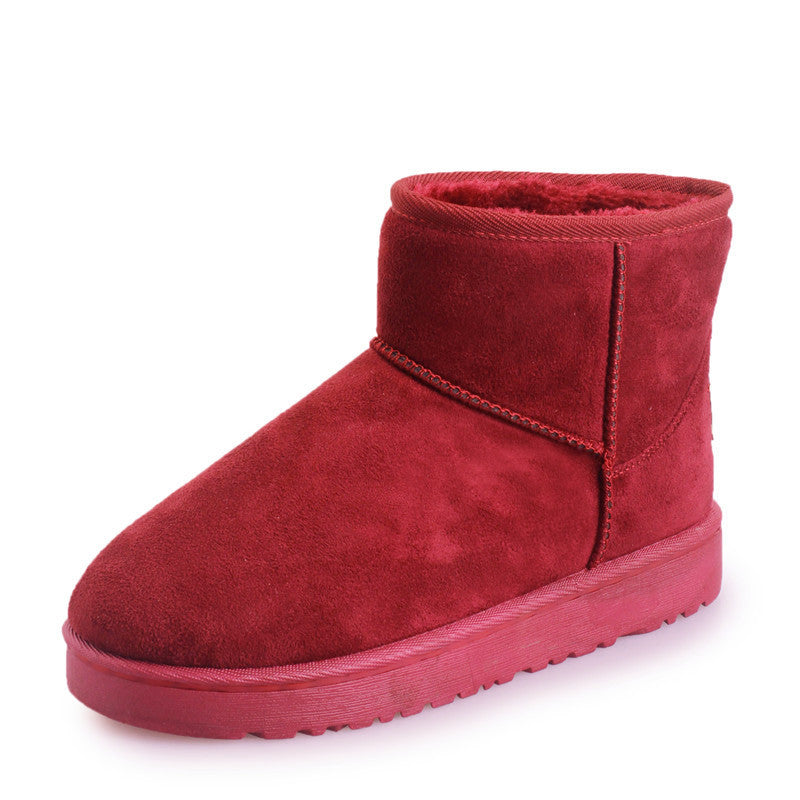 Women’s winter snow boots in red suede with faux fur lining and treaded rubber sole