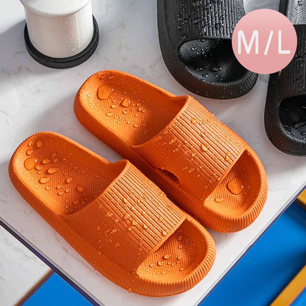 Orange slide sandals with wide ribbed strap and contoured cushioned footbed