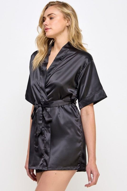 Black satin V-neck robe with tied waist belt and short sleeves, side view