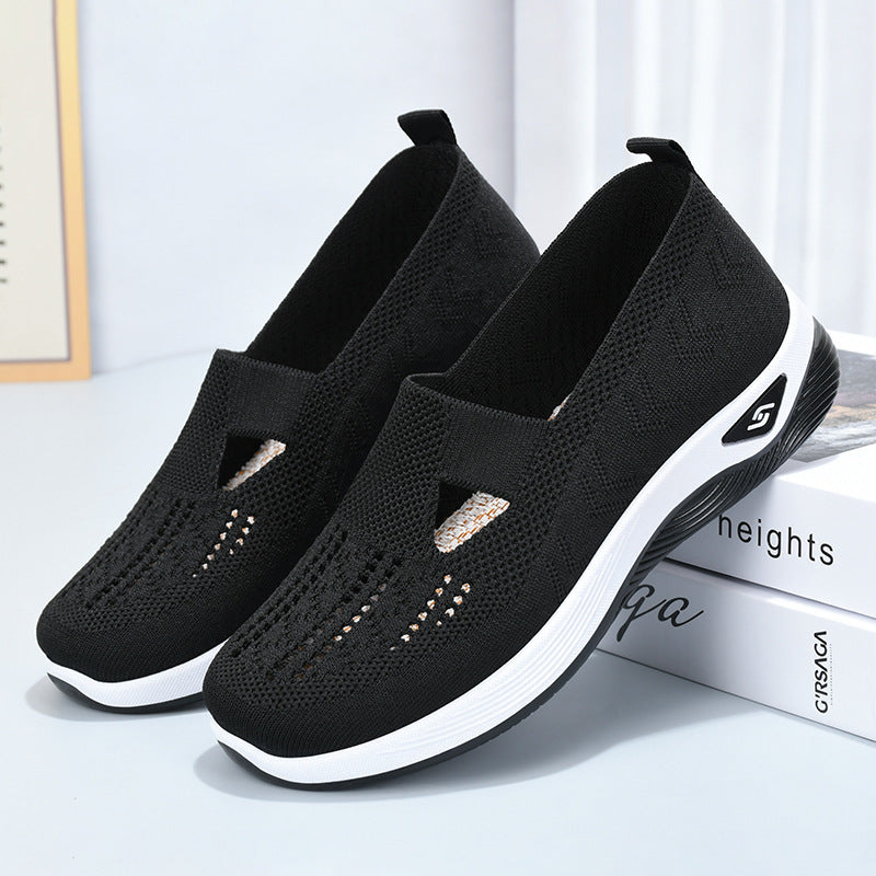 Women’s breathable mesh slip-on shoes, black with white sole and side logo patch