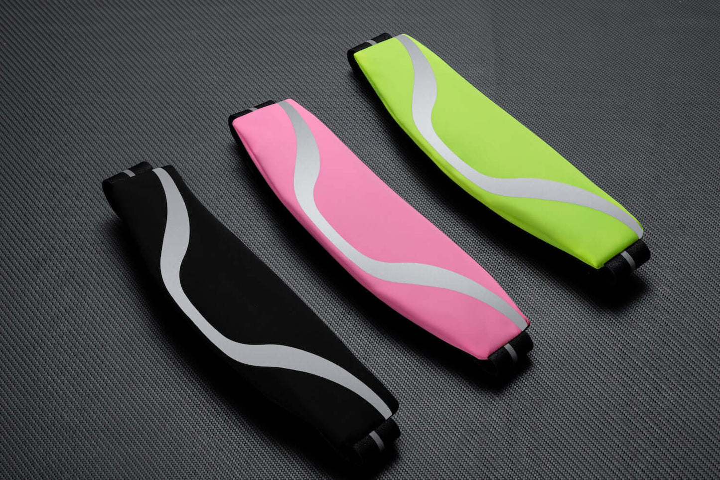 Water-resistant sport waist pack running belt set with pink and neon green reflective stripes.