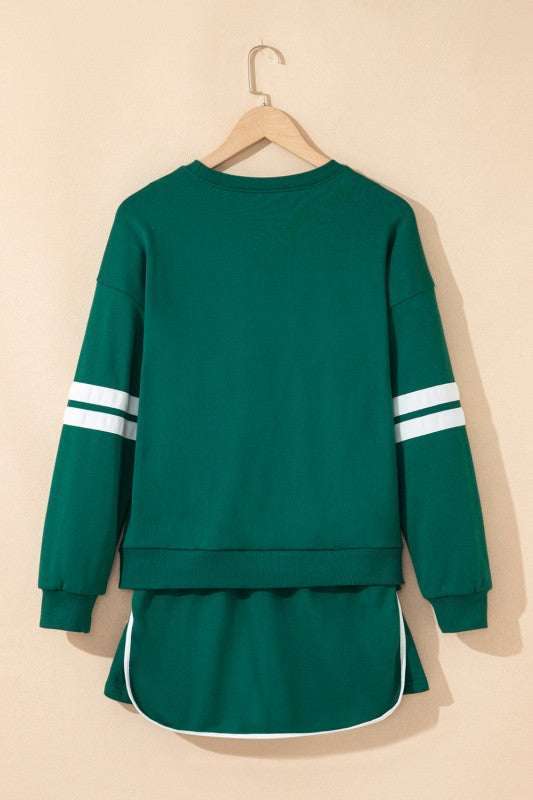 Green pullover back with white striped sleeve cuffs and drawstring mini skirt