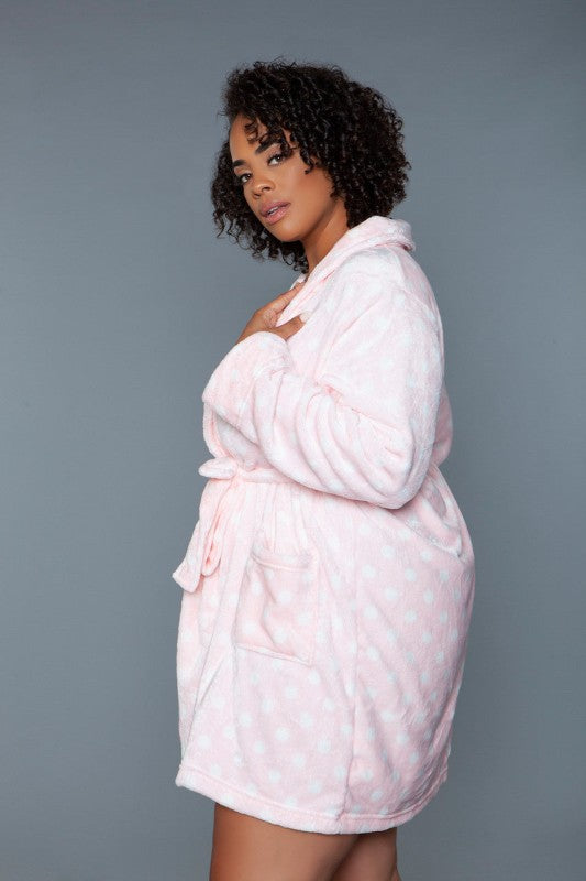 Light pink plush hooded robe with wrap front and tie belt, side view