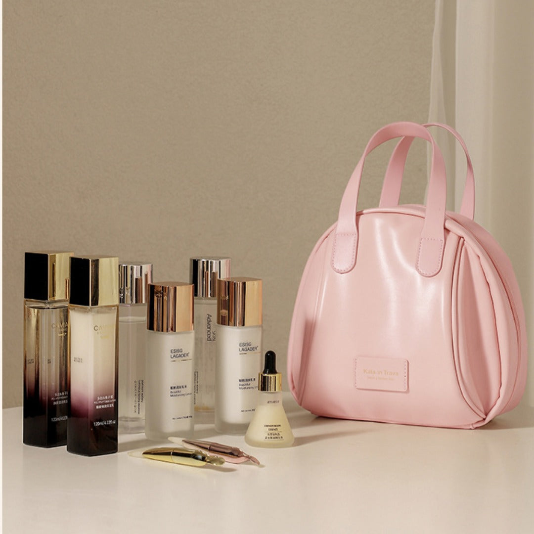 Pink waterproof cosmetic tote bag with curved handles and front label pocket