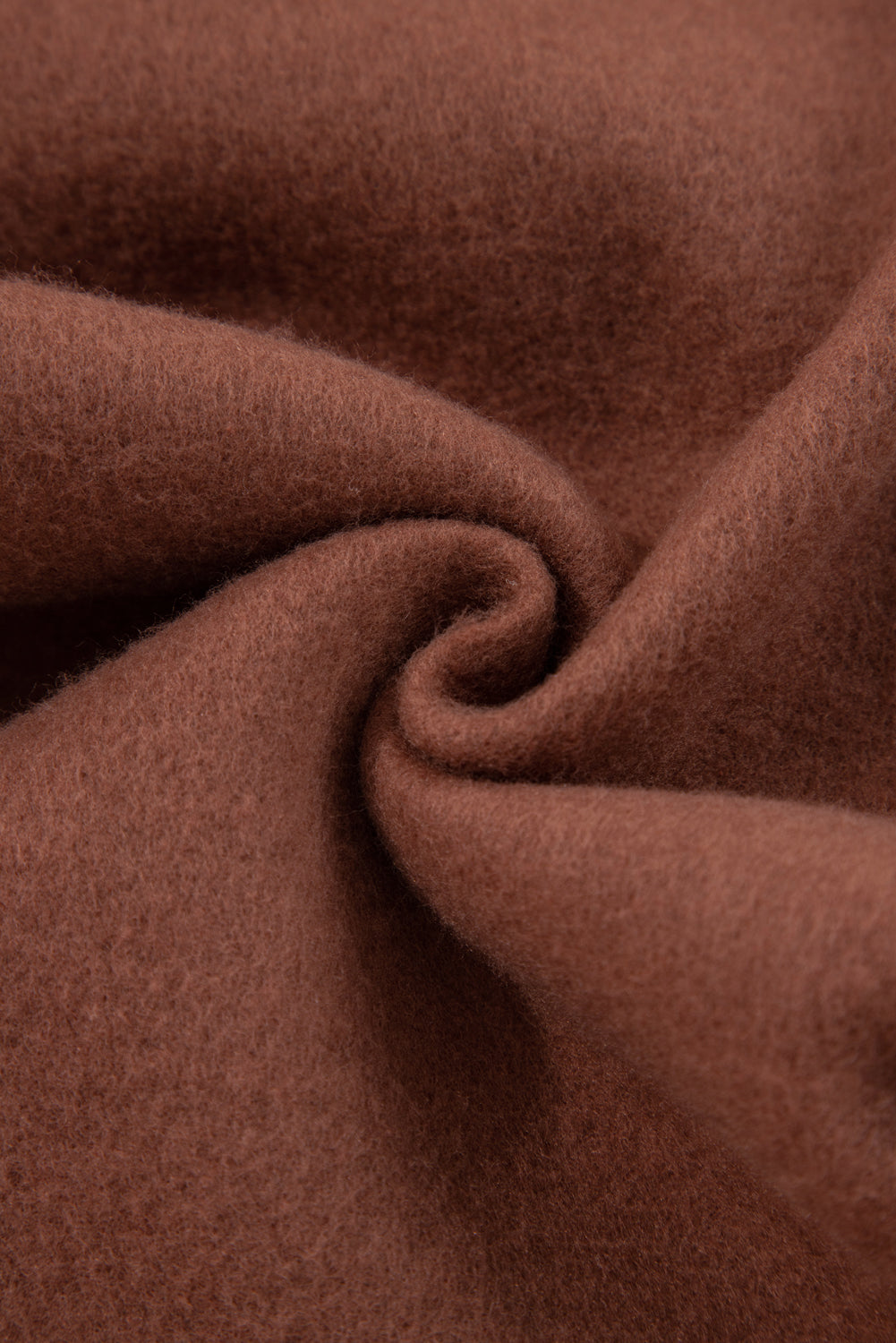 Coffee-brown fabric close-up showing soft knit texture