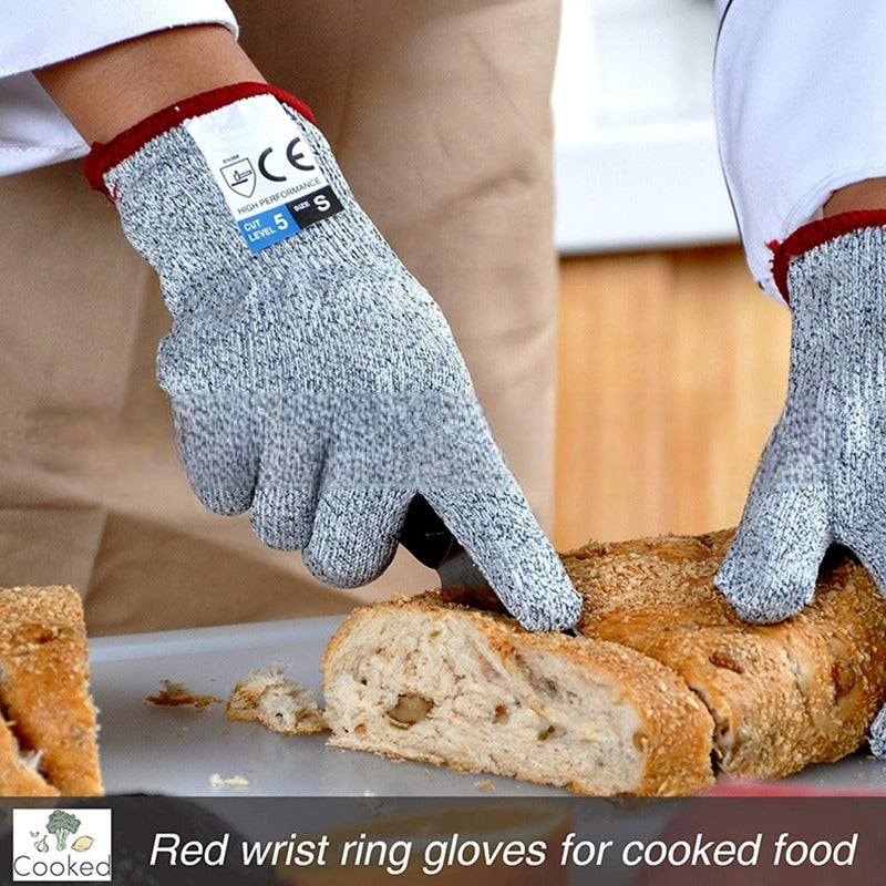 Grey anti-cut kitchen gloves worn, textured knit and red cuff trim visible
