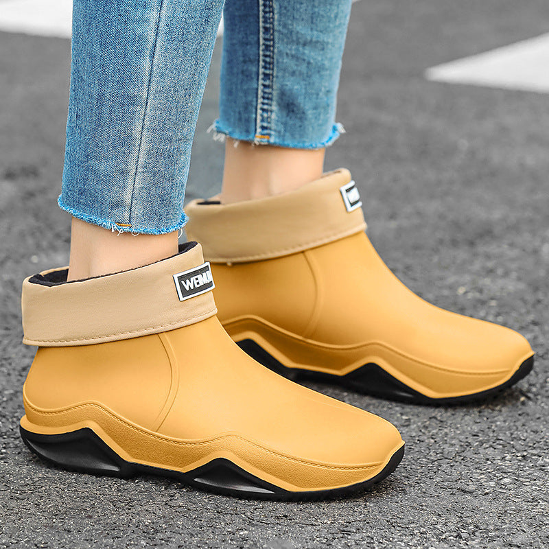 Men's short rain boots in tan with black sole and side logo patch