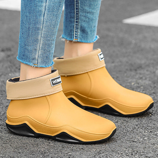 Men's short rain boots in tan with black sole and side logo patch