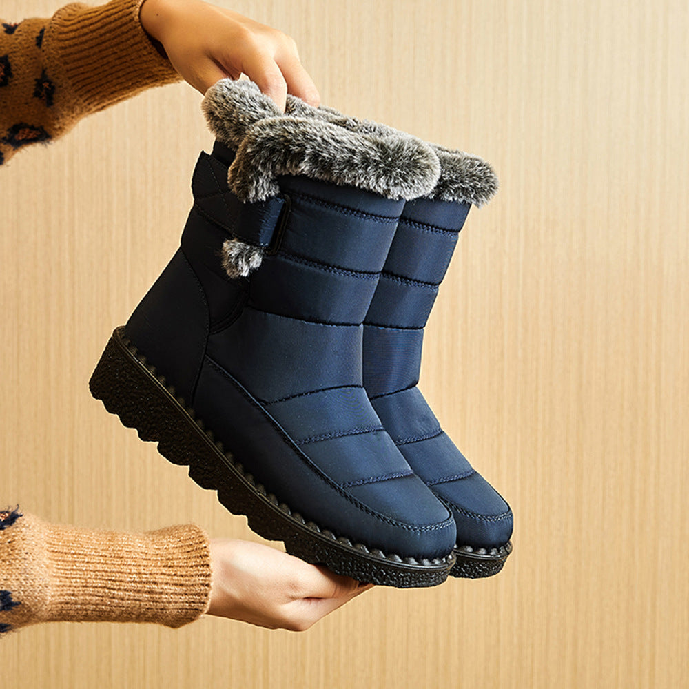 Navy-blue snow boots with faux-fur cuff, hook-and-loop strap, chunky platform sole