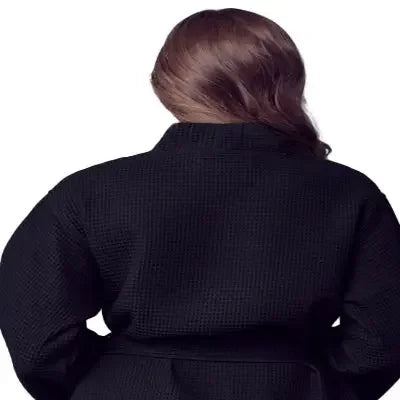 Womens waffle robe, black, back view with tie belt and long sleeves close-up.