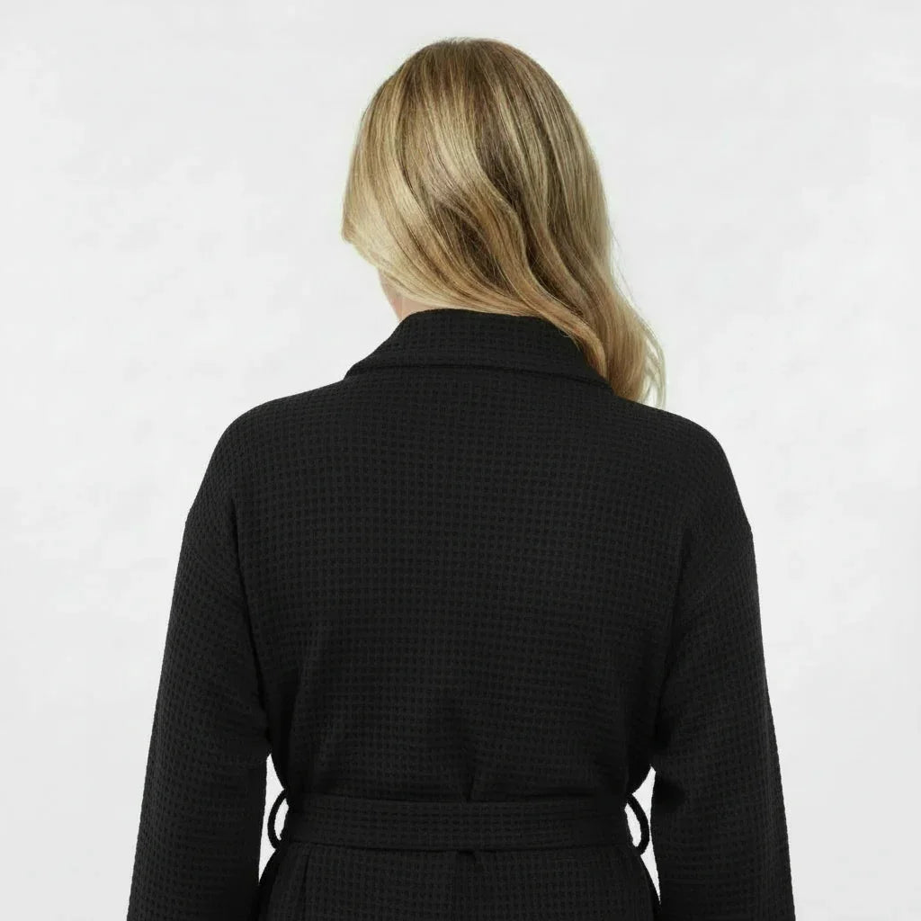Women’s waffle robe in black, back view with tie belt and textured waffle knit.