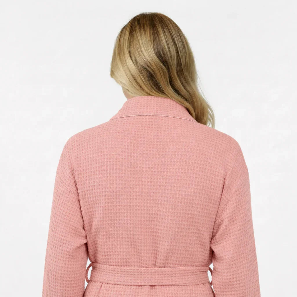 Women’s blush pink waffle robe back view with waist belt and shawl collar