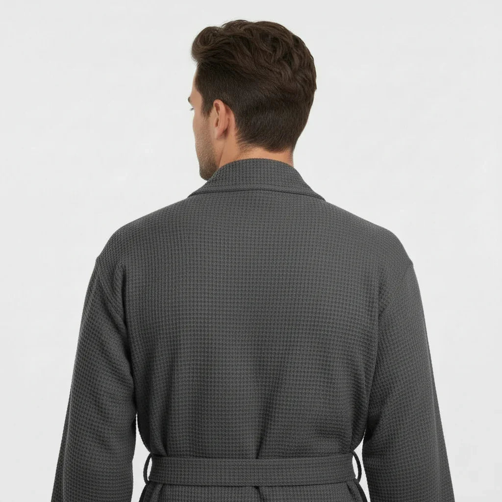 Men's waffle spa bathrobe in charcoal grey, back view with belted waist and waffle-knit texture.