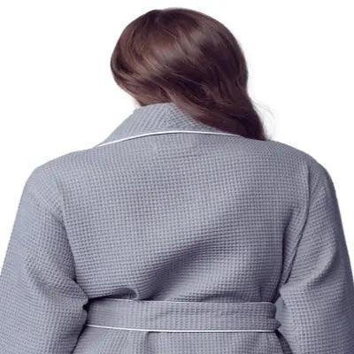 Women’s waffle bathrobe with white piping, gray back view with belt tie.