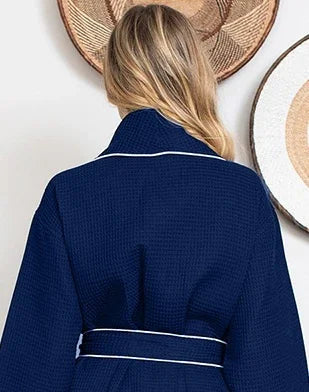 Women’s knee-length waffle robe, navy with white piping and tie belt
