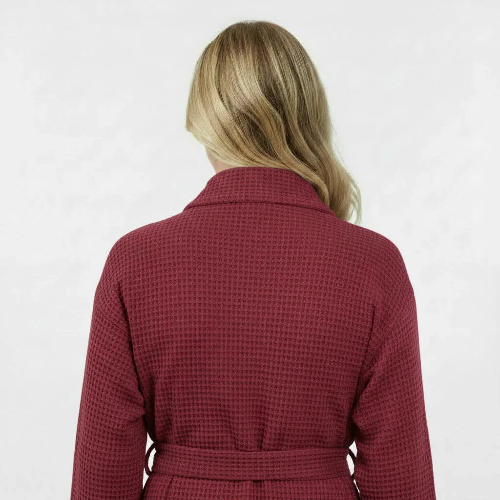 Women’s waffle robe in wine red, back view with tie belt at waist.