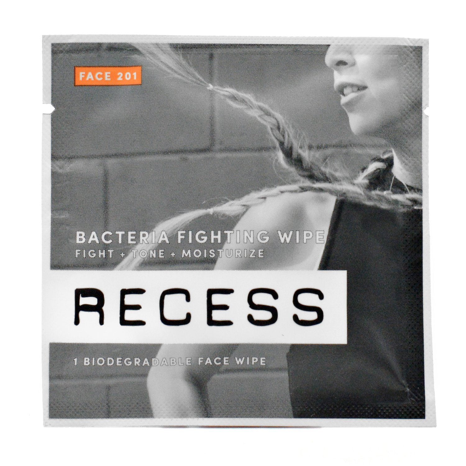 Biodegradable face wipe sachet with RECESS branding and FACE 201 orange label