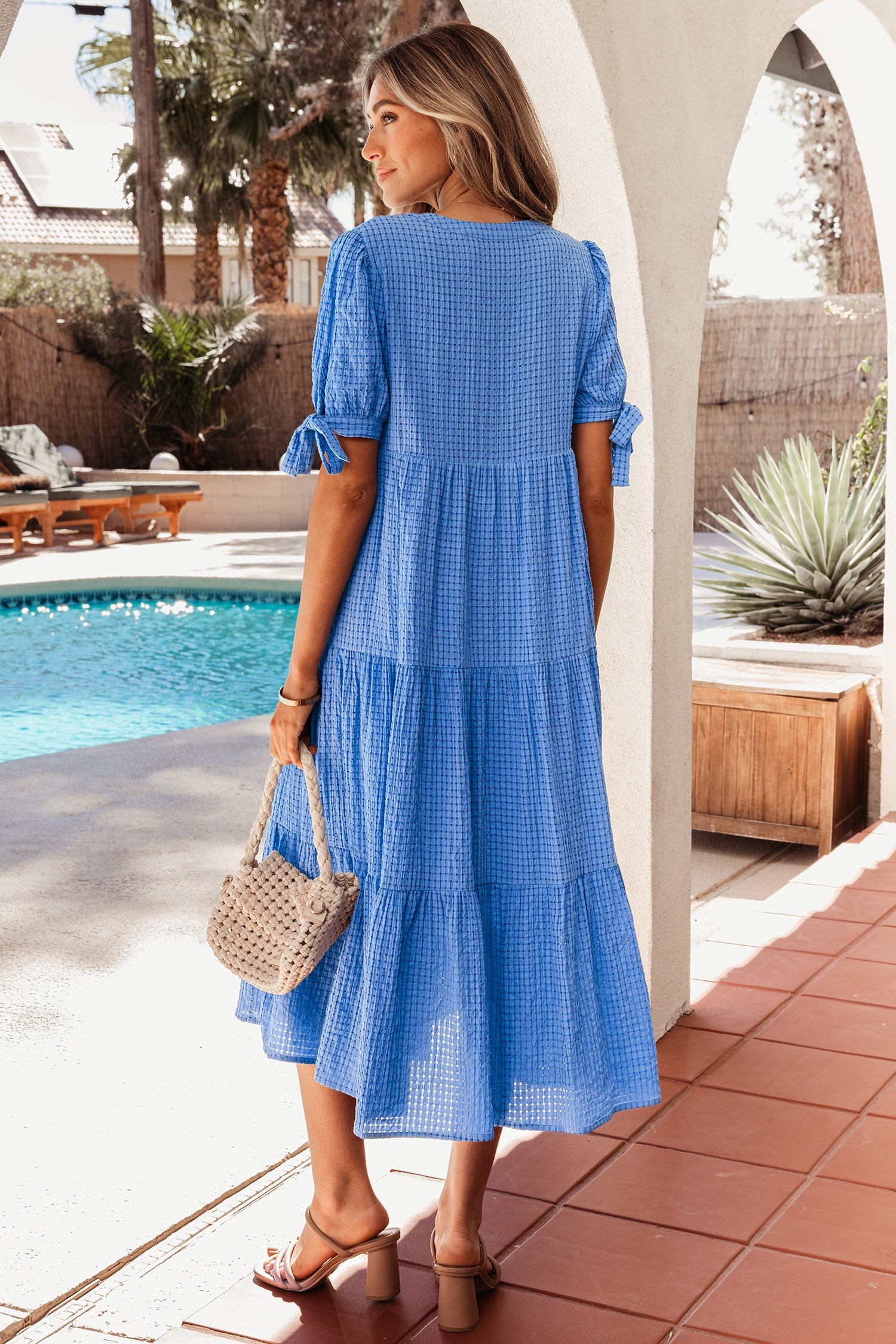 Dusk blue tiered midi dress with V-neck and gathered tier skirt