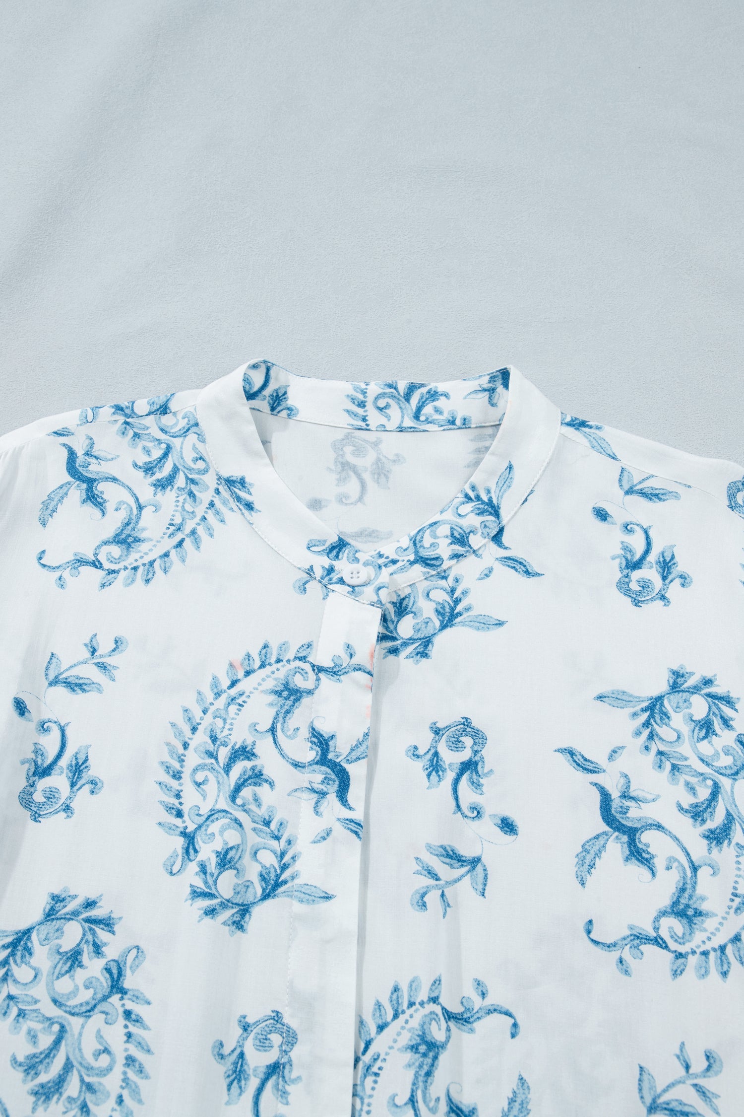 Sky blue floral print V-neck short sleeves with small button placket