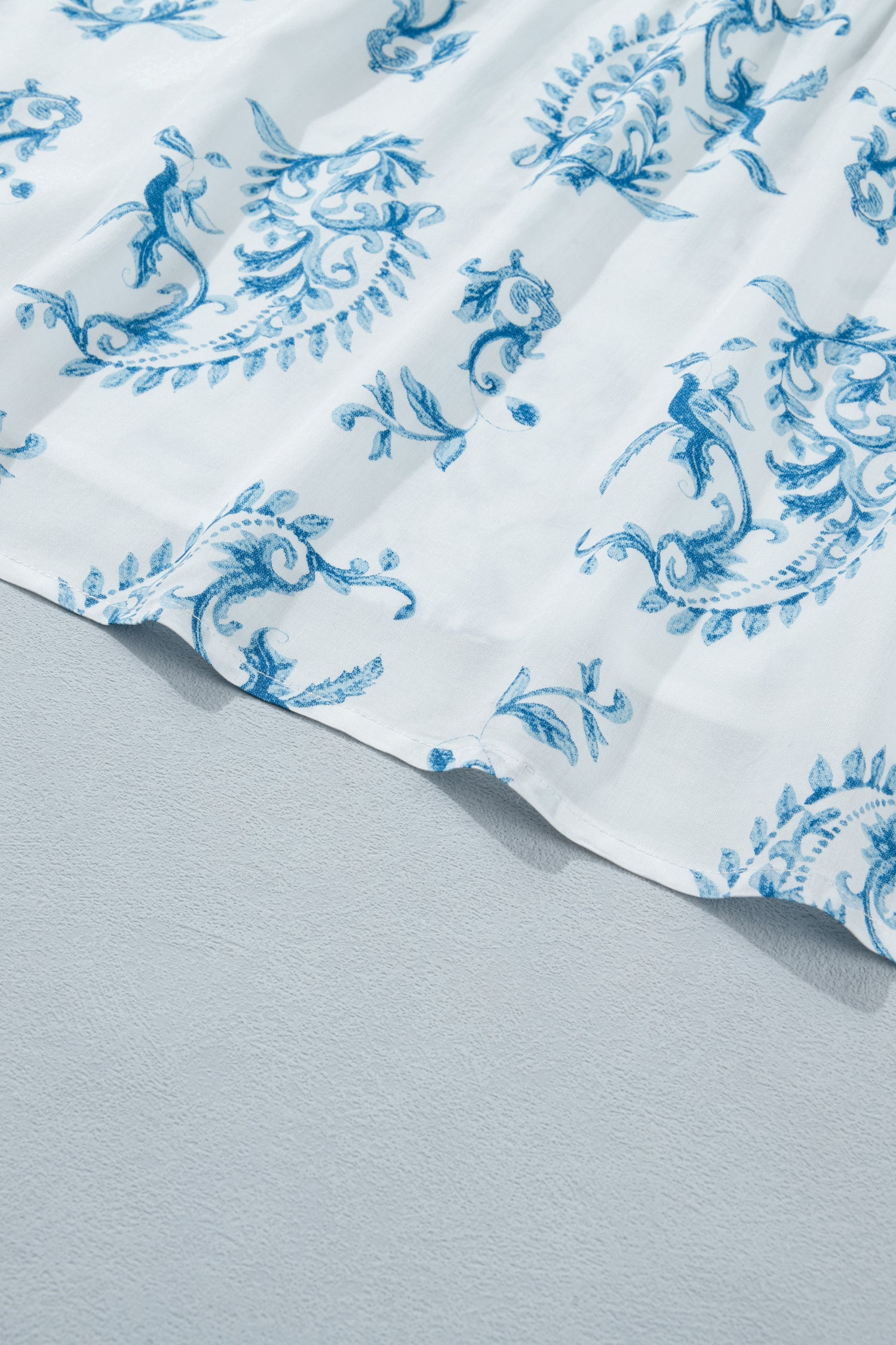 Sky blue floral print maxi dress skirt with gathered tiers and flowing drape