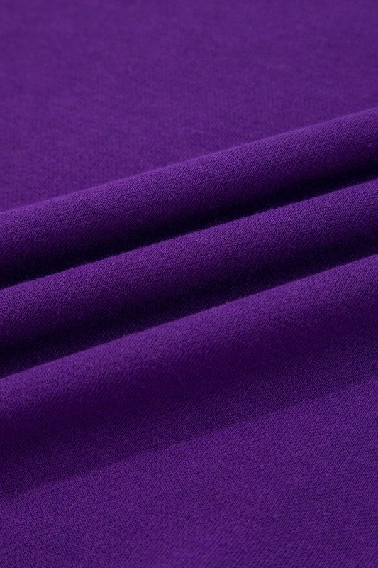 Purple knit fabric with subtle texture on the pullover