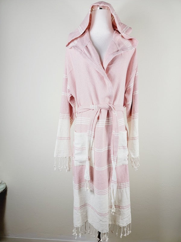 Pink hooded bathrobe with tie belt and striped paneling; fringed ends at cuffs