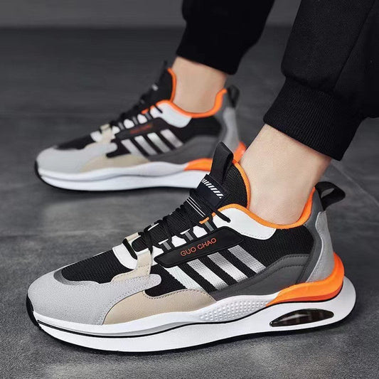 Breathable mesh sneakers in black, white, and orange with air-cushion sole