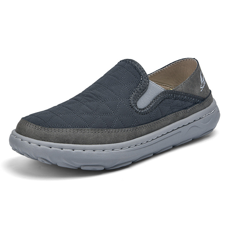 Men's casual travel slip-on shoes in dark blue, cushioned sole with stitched side panels